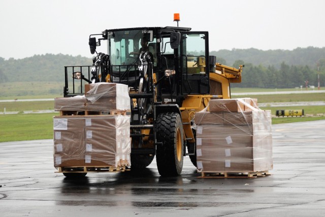 Airmen move cargo Aug. 5, 2021, at the Sparta-Fort McCoy Airport at Fort McCoy, Wis., in preparation for the exercise Patriot Warrior 2021. Patriot Warrior is Air Force Reserve Command's premier exercise, providing an opportunity for Reserve...