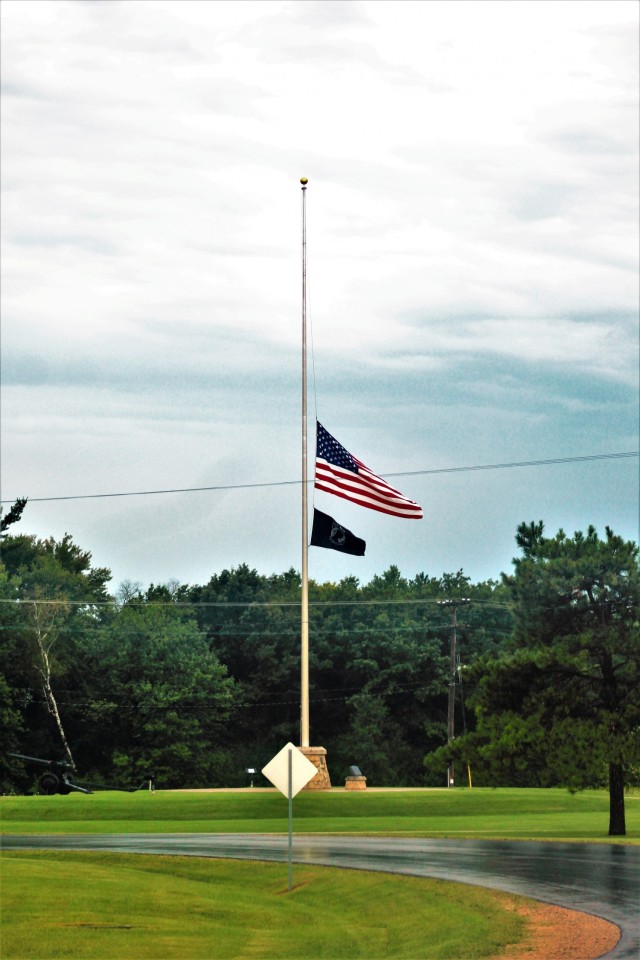 The United States flag flies at half-staff Aug. 27, 2021, at Fort McCoy, Wis. The lowering of the flag was a mark of respect in recognition of the U.S. service members and other victims killed in a terrorist attack Aug. 26, 2021, in Kabul,...