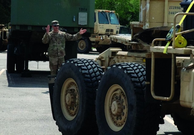 A U.S. Army Soldier with the Michigan Army National Guard’s 1463rd Transportation Company guides a truck at their home station in Augusta after transporting ammunition as part of Operation Patriot Press. 