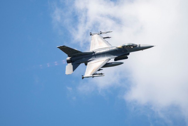 An Air Force F-16 Fighting Falcon flies over Fort McCoy, Wis., on Aug. 13, 2021. The fighter jet was participating in the Northern Lightning 2021 exercise at nearby Volk Field, Wis. F-16s also dropped 500-pound Joint Direct Attack Munitions for...