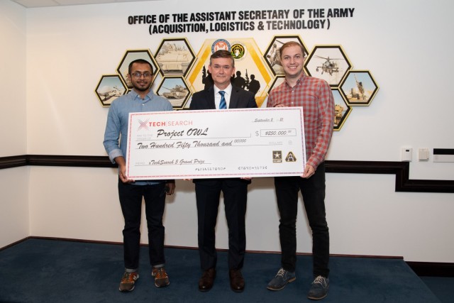 Douglas R. Bush, acting assistant secretary of the U.S. Army for acquisition, logistics and technology, presents awards to members of the Army's xTech Program at the Pentagon in Washington, D.C., Sept. 2, 2021. (U.S. Army photo by Laura Buchta)