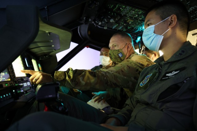 Chief Warrant Officer 4 Ryan Kennedy, a UH-60 Black Hawk helicopter pilot with the 96th Aviation Troop Command, Washington Army National Guard, trains with his Royal Thai Army counterparts in a Black Hawk simulator, Aug. 31, 2021, at Joint Base...