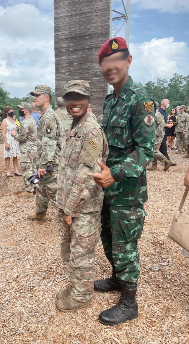 JOINT BASE LEWIS MCCHORD- Wash. – A U.S. Army captain assigned to 1st Special Forces Group (Airborne) poses in front of the U.S. Army Ranger School welcome sign after becoming the first female in 1st SFG (A) to graduate Ranger school while...