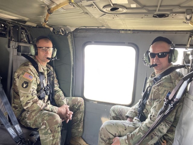 Command Sgt. Maj. Matthew Strasser and Command Sgt. Maj. Jeremy Strasser ride in a UH-60 Blackhawk during their deployment to Kosovo together in 2020. On Sept. 10, 2021, Matthew passed responsibility of the 2nd Infantry Brigade Combat Team, 34th...