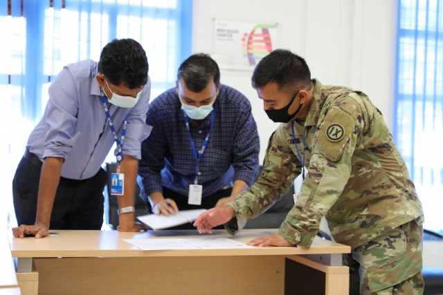 U.S. Army Maj. Melvin Cabebe of the 9th Mission Support Command speaking with consultants for the World Health Organization in Dili, Timor-Leste on Jul.29, 2021. Cabebe has been working closely with the WHO, USAID, the U.S. Embassy and the...