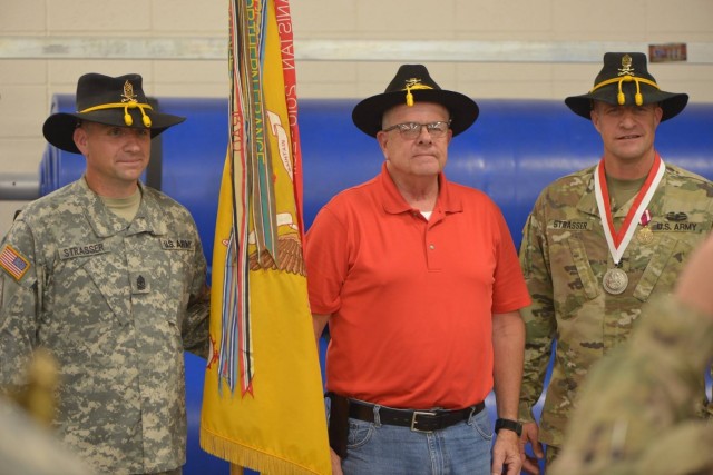 Ret. Sgt. Maj. Gary Strasser stands with his sons, then Sgt. Maj. Jeremy Strasser and Command Sgt. Maj. Matthew Strasser, during Matthew’s change of responsibility ceremony for the 2nd Infantry Brigade Combat Team, 34th Infantry Division, Iowa...