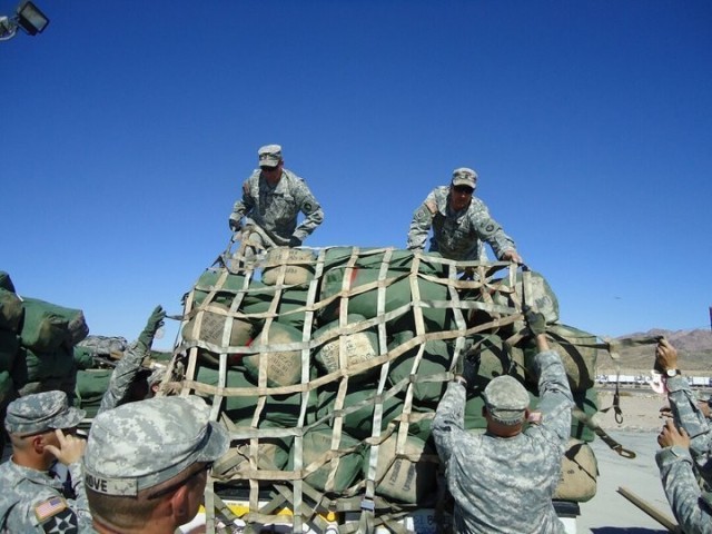 Then Sgt. Maj. Matthew Strasser and then Sgt. 1st Class Jeremy Strasser help load sandbags at Fort Irwin, Calif., before their deployment to Afghanistan in 2010. On Sept. 10, 2021, Matthew passed responsibility of the 2nd Infantry Brigade Combat...