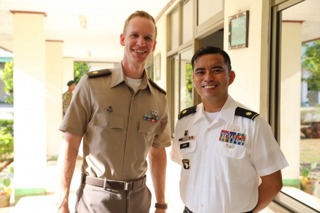 From left, Maj. John Anderson, U.S. Embassy and U.S. Army Maj. Melvin Cabebe, 9th Mission Support Command, enjoying a moment at the closing ceremony for Exercise  Dalan ba Dame 21 Aug. 6, 2021. Maj. Anderson and Maj. Cabebe worked closely together...