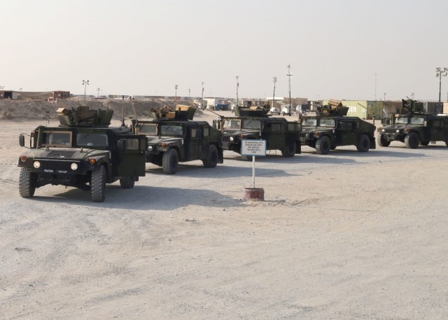 Humvees belonging to Fort Bragg, North Carolina, based Delta Company, 1st Battalion, 504th Infantry Regiment, 1st Brigade Combat Team, 82nd Airborne Division, lined up Sept. 1, 2021, in a lot at Camp Arifjan, Kuwait, to be accounted for by Army Field Battalion-Southwest Asia, 401st Army Field Support Brigade before rolling out to the camp's wash rack and final disposition and shipment back to Fort Bragg. Delta Company provided support to evacuation operations at Kabul’s Hamid Karzai International Airport as part of Operation Allies Refuge.