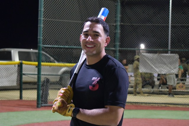 Sgt. Jeremy Paz-Rivera, an information technology specialist assigned to the Fort Bragg, N.C., based 3rd Expeditionary Sustainment Command, pauses from batting practice, Sept. 13, 2021, at Camp Arifjan, Kuwait. Paz-Rivera, whose unit assumed the 1st Theater Sustainment Command’s operational command post mission in late August, was crowned the Camp Arifjan Softball Home Run Derby King for hitting 19 homeruns during a competition, Sept. 6.