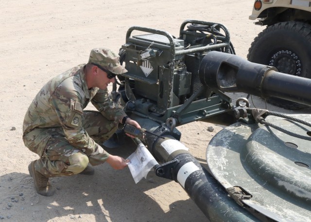Staff Sgt. Jeremy Driscoll, the air noncommissioned officer in charge with the Fort Bragg, N.C., based 3rd Battalion, 319th Airborne Field Artillery Regiment, 1st Brigade Combat Team, 82nd Airborne Division, verifies documentation on one of the battalion's M119 howitzers during a survey of gear collected and secured by the 401st Army Field Support Brigade in one of their lots at Camp Arifjan, Kuwait, Sept. 1, 2021. Driscoll and his fellow "Gun Devils" deployed to Kabul’s Hamid Karzai International Airport during Operation Allies Refuge to support evacuation operations as the U.S. military ended operations in Afghanistan.