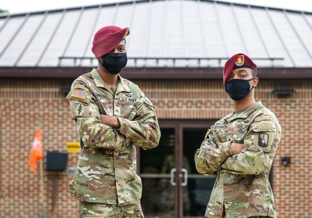 U.S. Army Cpl. Christian Simmons and Cpl. Tadow McDonald, assigned to 55th Signal Company (Combat Camera), 21st Signal Brigade, wear facemasks while standing in front of their unit’s headquarters on Fort George G. Meade, Maryland, Aug. 3, 2021. Per the guidance in a DoD memorandum released on July 28, 2021, areas of substantial or high community transmission requires service members, federal employees, on-site contractor employees and visitors, regardless of their vaccination status, to wear a mask in an indoor setting and other facilities owned or leased by the DoD. (U.S. Army photo by Sgt. Henry Villarama)