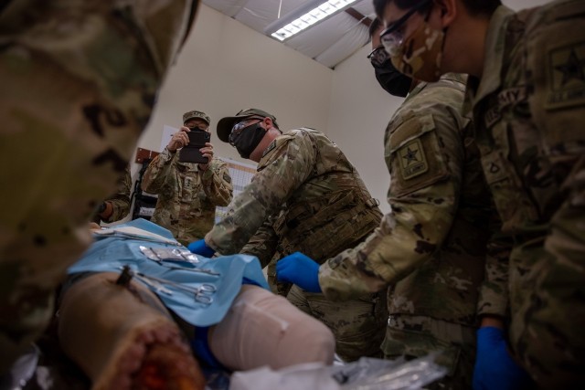 Lt. Gen. Theodore Martin, Commander U.S. Army Combined Arms Center, or CAC, visited the U.S. Army Medical Center of Excellence, Joint Base San Antonio-Fort Sam Houston, Texas, September 8-10. Pictured taking a photo of 68W Combat Medic’s training during a culminating Field Training Exercise at the Soldier Medic Training Site, Medical Education and Training Campus, Joint Base San Antonio-Camp Bullis, September 10. 