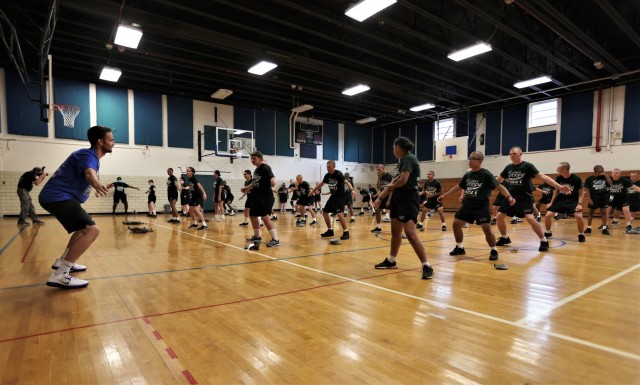Former University of Kentucky basketball player Jarrod Polson leads cadets from the Bluegrass ChalleNGe Academy at Fort Knox in the Shoot Hoops Not Drugs camp Sept. 14, 2021.