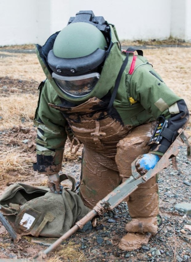 An Explosive Ordnance Disposal Technician prepares to defeat an explosive device during Exercise Ardent Defender 2014 in Halifax, Nova Scotia.  The multinational exercise has been held in Canada every year since 2012.  It will be held at Canadian Forces Base Borden in Borden, Ontario, from Sept. 18 – Oct. 22, 2021.  Canadian Armed Forces photo by Warrant Officer Jerry Kean, 5th Canadian Division.