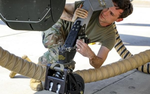 A Soldier secures landing equipment on a Grey Eagle autonomous weapons system during Project Convergence 20, a demonstration of modernized warfare capabilities at Yuma Proving Ground, Arizona, September 17, 2020.