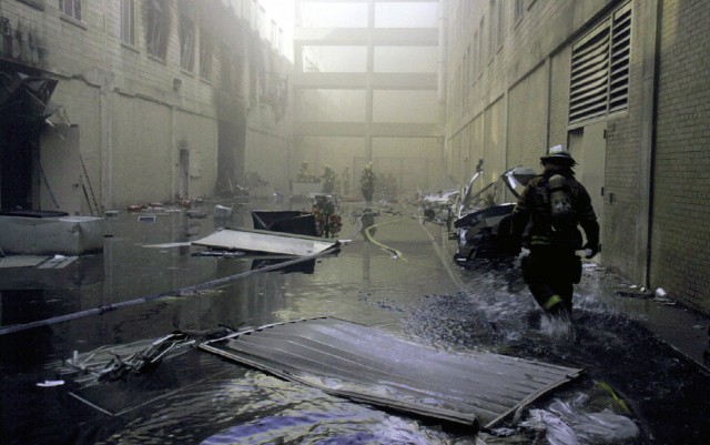 A Military District of Washington (MDW) Engineer Company (Technical Rescue) firefighter makes his way towards the fire on the second day after the attack. The morning before, in an attempt to frighten the American people, five members of Al-Qaida,...
