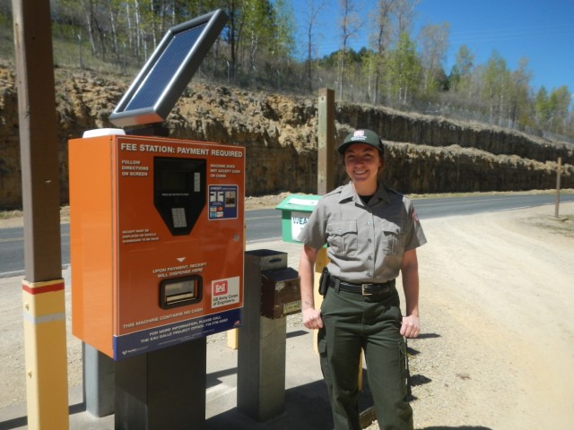 Cheyanne Carlin, Eau Galle park ranger, shows off the new fee machine at Eau Galle Recreation Area near Spring Valley, Wisconsin, May 13.