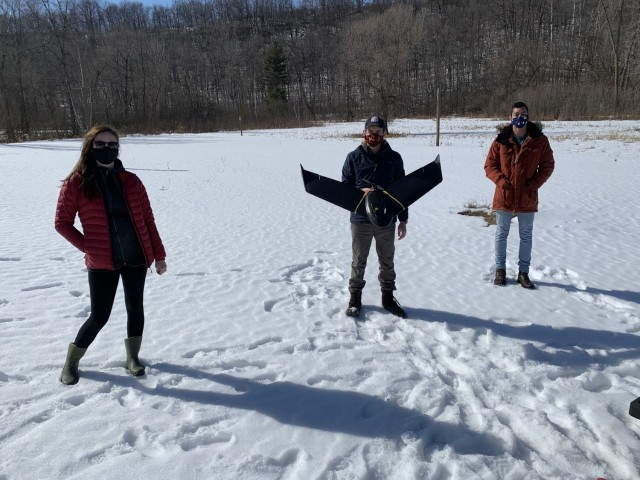 Kevin Hanson, geographer, and Zach Rogers, biologist, prepare for a flight at Eau Galle Recreation Area, near Spring Valley, Wisconsin, March 1.