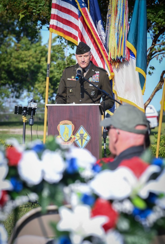 U.S. Army Training Center and Fort Jackson Commander Brig. Gen. Patrick R. Michaelis speaks to roughly 100 attendees during a Sept. 10, 2021, wreath laying and remembrance ceremony held at Centennial Park on Fort Jackson.