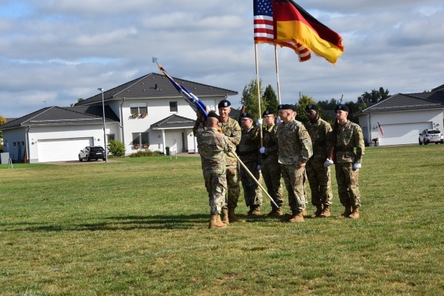 Col. Jonathan Byrom takes the 2nd Multi-Domain Task Force colors from Gen. Christopher Cavoli, commander general of U.S. Army Europe and Africa, as he accepts his command of the unit.