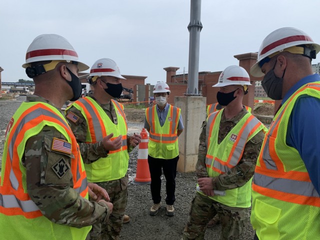 Brig. Gen. Kirk Gibbs, U.S. Army Corps of Engineers Pacific Ocean Division commander (top left), and Command Sgt. Maj. Douglas Galick, POD command sergeant major (top right), visit FED construction site, FH100 Army Family Housing Towers, to view ongoing construction and to speak with the project delivery team at USAG Humphreys, Aug. 25