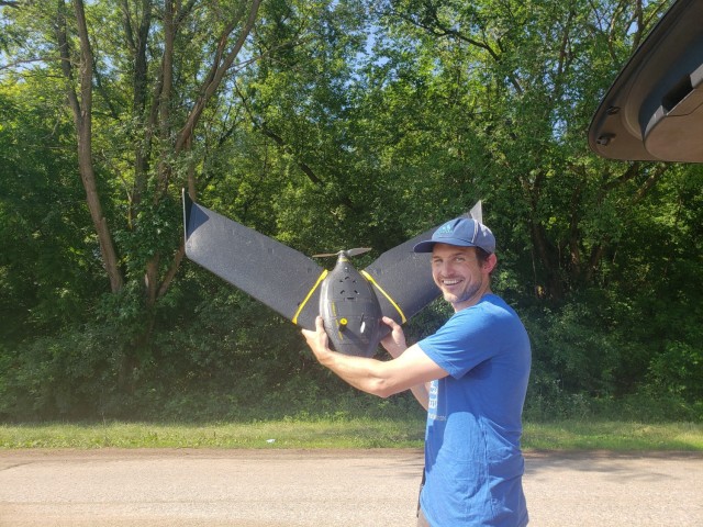 Kevin Hanson, geographer, holds a small unmanned aircraft at the Wabasha gravel pit, near Wabasha, Minnesota, June 30.