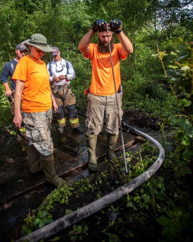 Fort Drum Cultural Resources teams with fire personnel to unearth history