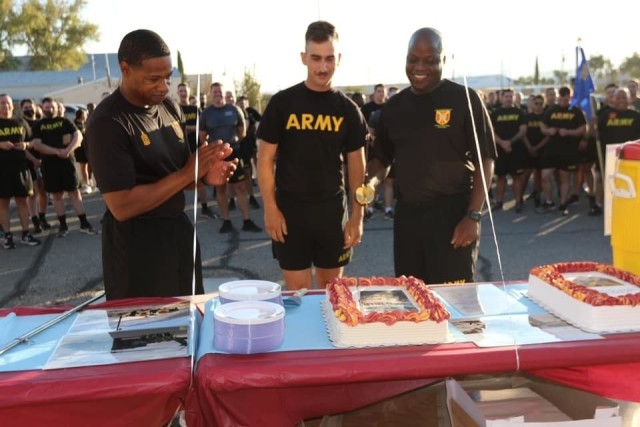 The 916th Support Brigade Command Team cut cake after their Brigade run.