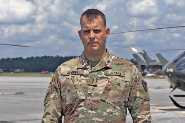 Chief Warrant Officer 4 Bradley J. Renneke, chief of standards and senior warrant adviser at Cairns Army Airfield for the 1st Battalion, 223d Aviation Regiment, U.S. Army Aviation Center of Excellence, stands on the Cairns flight line at Fort...