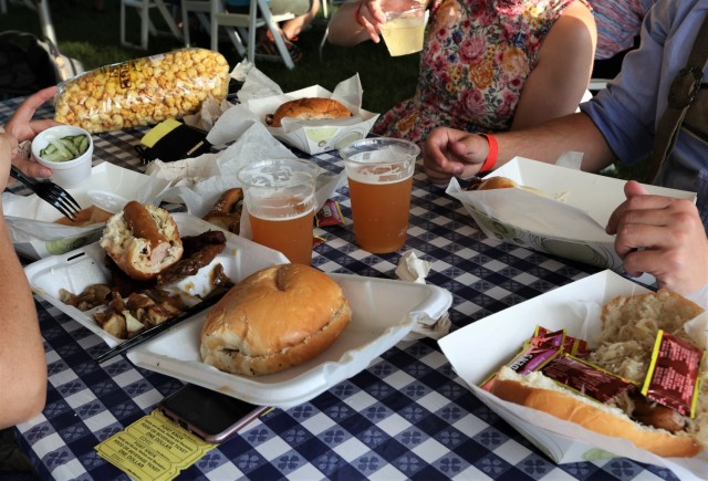 Attendees enjoy a variety of German-inspired fare at the annual Fort Knox Oktoberfest celebration Sept. 17, 2021, to include pretzels, bratwurst and schnitzel. German beer and wine were also available.