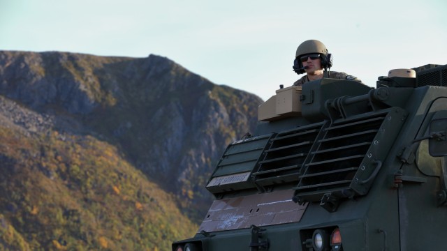 Staff Sgt. Dor Snodgrass, multiple launcher rocket system section chief, 1st Battalion, 6th Field Artillery Regiment, 41st Field Artillery Brigade awaits the Thunder Cloud live-fire exercise to begin in Andoya, Norway, Sept. 15, 2021. 1-6 FA worked with 2nd Multi-Domain Task Force-Europe to test sensor to shooter systems in the Arctic Circle. The multi-domain capabilities in Europe will integrate assets to overcome adversary anti-access/area denial tactics through integration and synchronization of a variety of capabilities. 
