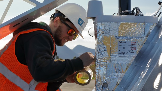 Brendan Branick, electronics lead at Raven Aerostar, prepares a high altitude balloon for launch in support of the Thunder Cloud live-fire exercise in Andoya, Norway, Sept. 15, 2021. Thunder Cloud was a sensor to shooter live-fire exercise that...