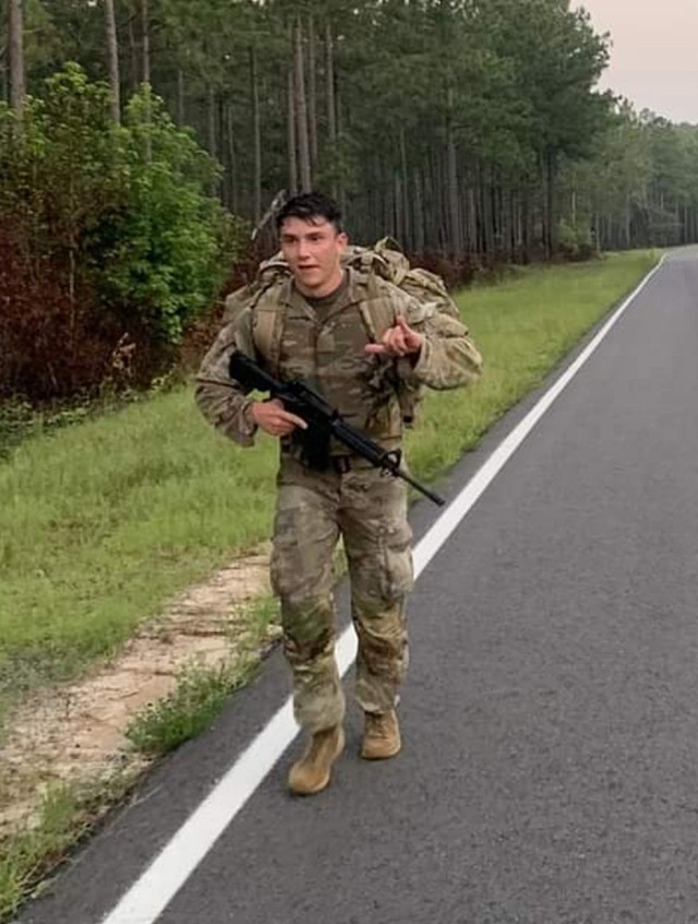 Staff Sgt. Charles Laabs of the 915th Cyberspace Warfare Battalion completes a 12-mile road march at Fort Gordon, Ga., as part of U.S. Army Cyber Command's 2021 Best Warrior Competition. Laabs went on to earn the title of ARCYBER Best Warrior NCO...