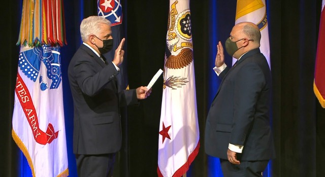 Christopher Lowman, left, administers the Oath of Office to SA Gregory Ford, swearing him in as the first director of the U.S. Army Criminal Investigation Division.