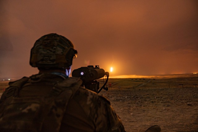 U.S. Army Illinois National Guard Sgt. 1st Class Michael Migliorisi, a forward observer assigned to 2nd Battalion, 122th Field Artillery Regiment, 33rd Infantry Brigade Combat Team, uses a Lightweight Laser Designator Rangefinder to observe artillery rounds exploding on the impact area of Polatlı Training Area, Turkey, during Dynamic Front Phase 2, Sept. 14, 2021. A forward observer reports where the rounds impact to the firing unit so they can adjust fire. 