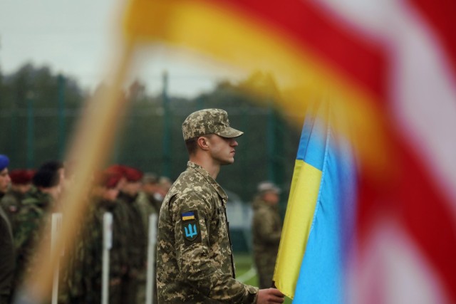 A Ukrainian soldier stands at the front of his formation during the opening ceremony for Rapid Trident 21, an annual Ukrainian-American training exercise, Sept. 20, at Central City Stadium, near Yavoriv, Ukraine. The exercise helps Ukraine to improve interaction and interoperability with the United States and NATO countries, thus contributing to European stability. 