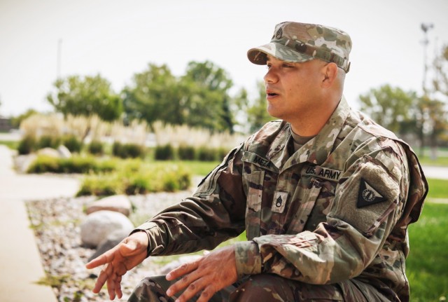 Staff Sgt. Henry Meza, an Iowa Army National Guard Soldier who works with the Service to Citizenship program, speaks about his childhood in Honduras at the Camp Dodge Joint Maneuver Training Center in Johnston, Iowa, on Sept. 7, 2021. Meza became...