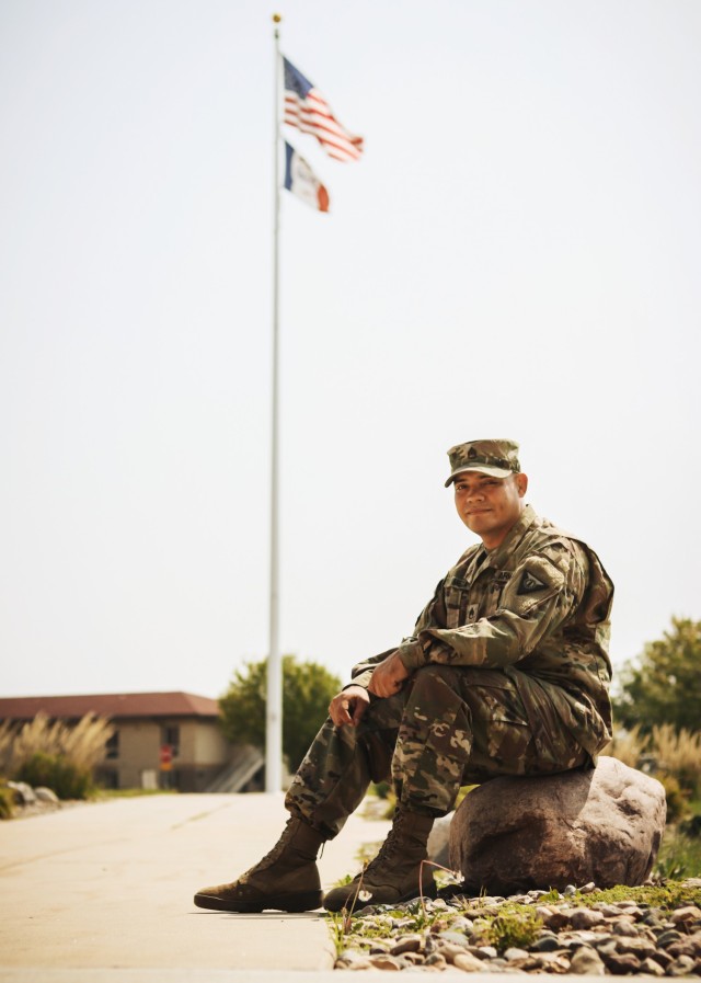 Staff Sgt. Henry Meza, an Iowa Army National Guard Soldier who works with the Service to Citizenship program, poses for a photo at the Camp Dodge Joint Maneuver Training Center in Johnston, Iowa, on Sept. 7, 2021. Meza grew up with a large family...