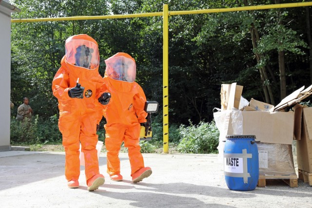 U.S. Army Reserve Staff Sgt. Ruberth Valencia (left), a survey team chief with the 773rd Civil Support Team, 7th Mission Support Command, based out of Kaiserslautern, Germany, prepares to enter a building with 773rd operations noncommissioned...