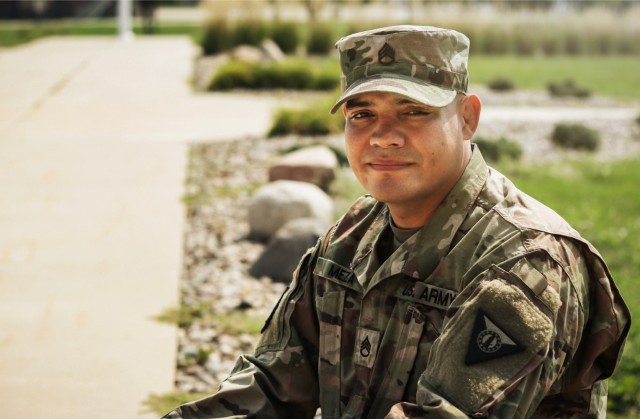 Staff Sgt. Henry Meza, an Iowa Army National Guard Soldier who works with the Service to Citizenship program, poses for a photo at the Camp Dodge Joint Maneuver Training Center in Johnston, Iowa, on Sept. 7, 2021. Meza grew up with a large family...