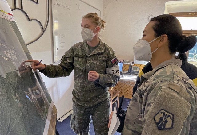 U.S. Army Reserve Capt. Shawna So, (right), a survey team leader with the 773rd Civil Support Team, 7th Mission Support Command, based out of Kaiserslautern, Germany, receives an exercise scenario mission brief from Slovac Armed Forces Capt. Lucia...