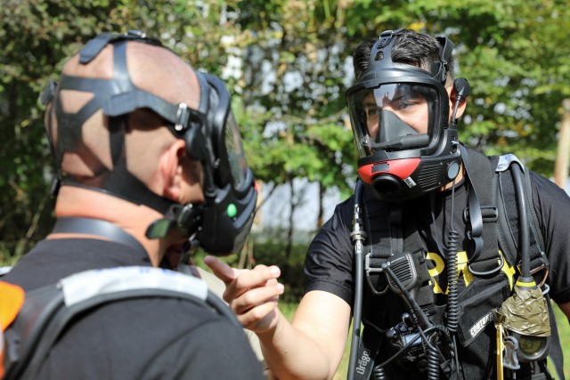 U.S. Army Reserve Staff Sgt. Ruberth Valencia (right), a survey team chief with the 773rd Civil Support Team, 7th Mission Support Command, based out of Kaiserslautern, Germany, tests communication capabilities with 773rd operations noncommissioned...