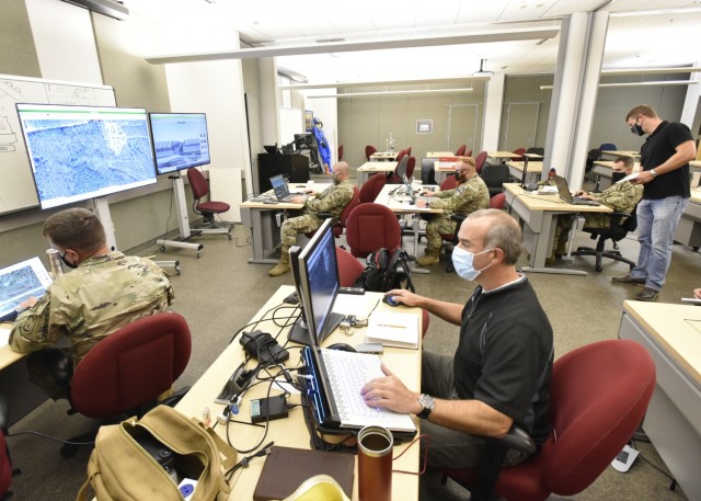 Soldiers assess the Protection Planning, Visualization and Assessment Tool, or PPVAT, a comprehensive, interactive decision-support tool that supports development, modification and validation of protection plans for deploying forces via 2D and 3D...