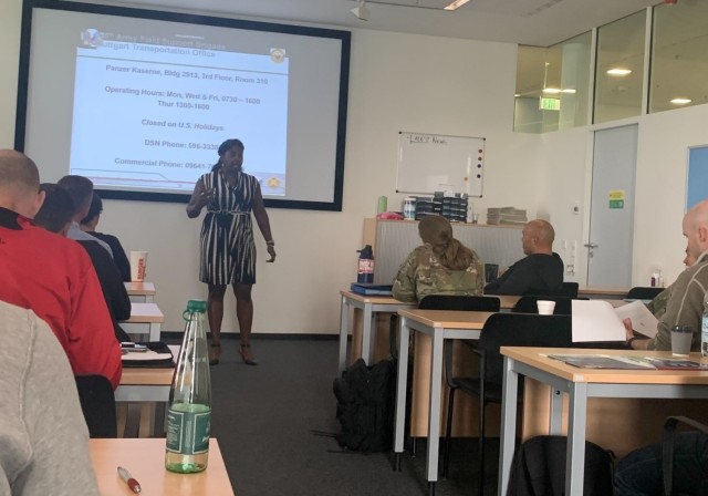 Jenn Page, a transportation counselor with the 405th Army Field Support Brigade’s Logistics Readiness Center-Stuttgart, conducts a transportation brief with community members stationed in the U.S. Army Garrison Stuttgart area of operation. Page...