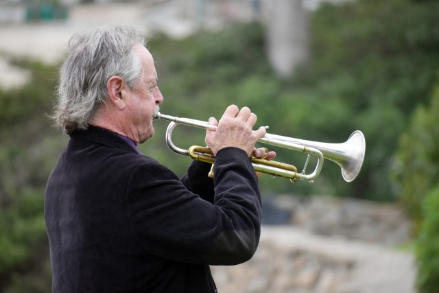 Brian Stock plays taps at Lovers Point Park, Pacific Grove, Calif., Sept. 17, during the “Afghanistan Servicemembers Memorial” for the 13 service members killed in action at the Kabul Airport on Aug. 26.