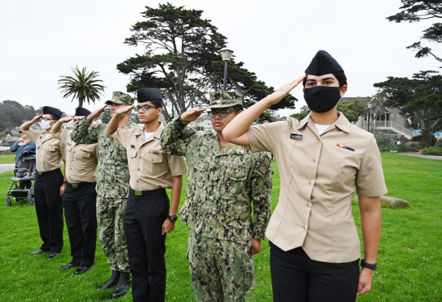 Sailors salute for the national anthem at Lovers Point Park, Pacific Grove, Calif., Sept. 17, during the “Afghanistan Servicemembers Memorial” for the 13 service members killed in action at the Kabul Airport on Aug. 26.