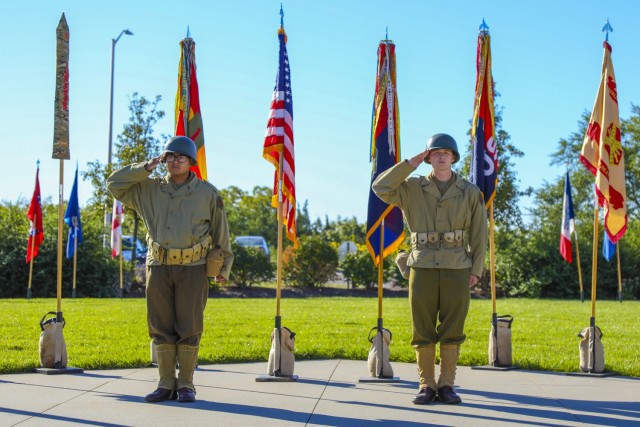 U.S. Army Spc. Alfonso Serna (left), a nodal-network systems operator-maintainer, and U.S. Army Pfc. Christian Long (right), a multichannel transmission systems operator, both assigned to Division Artillery, 1st Infantry Division, render salute...