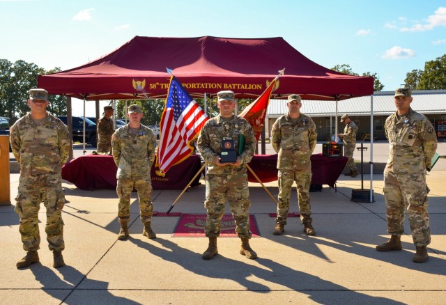 From left: Staff Sgts. Ernest Haefner, Steven Burns, Gabriel Ortiz, Gilbert Briceno and Sgt. 1st Class Timothy Kroon from the 58th Transportation Battalion, were named the top team at the sixth-annual Joint Service Truck Rodeo Sept. 17 at Training Area 228.