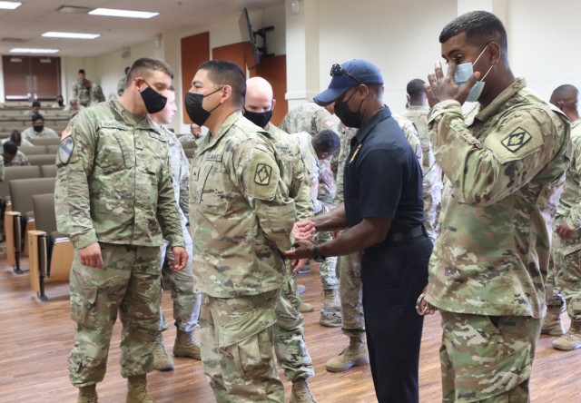 Jim Hayes, Department of the Army Civilian Police, demonstrates one of the techniques to properly get control of and handcuff 1st Lt. Tyler Thompson during gate guard training Sept. 17, 2021, at Burleson Hall.